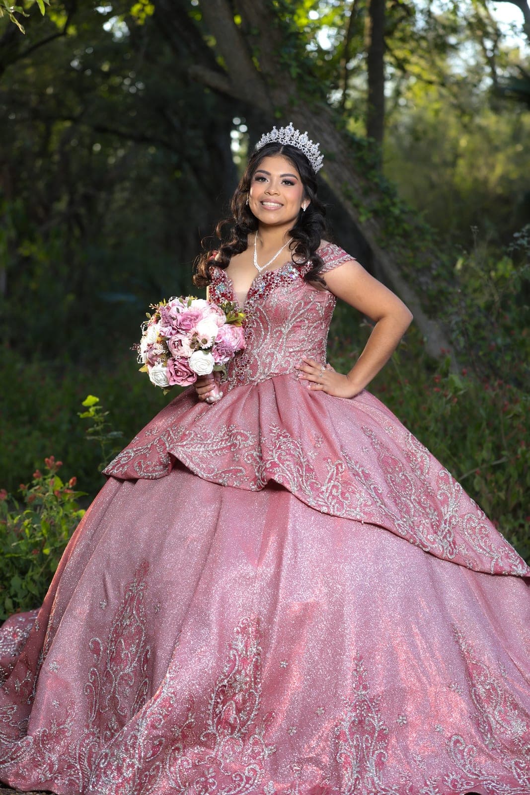 Quinceañera in a full rose ball gown and tiara